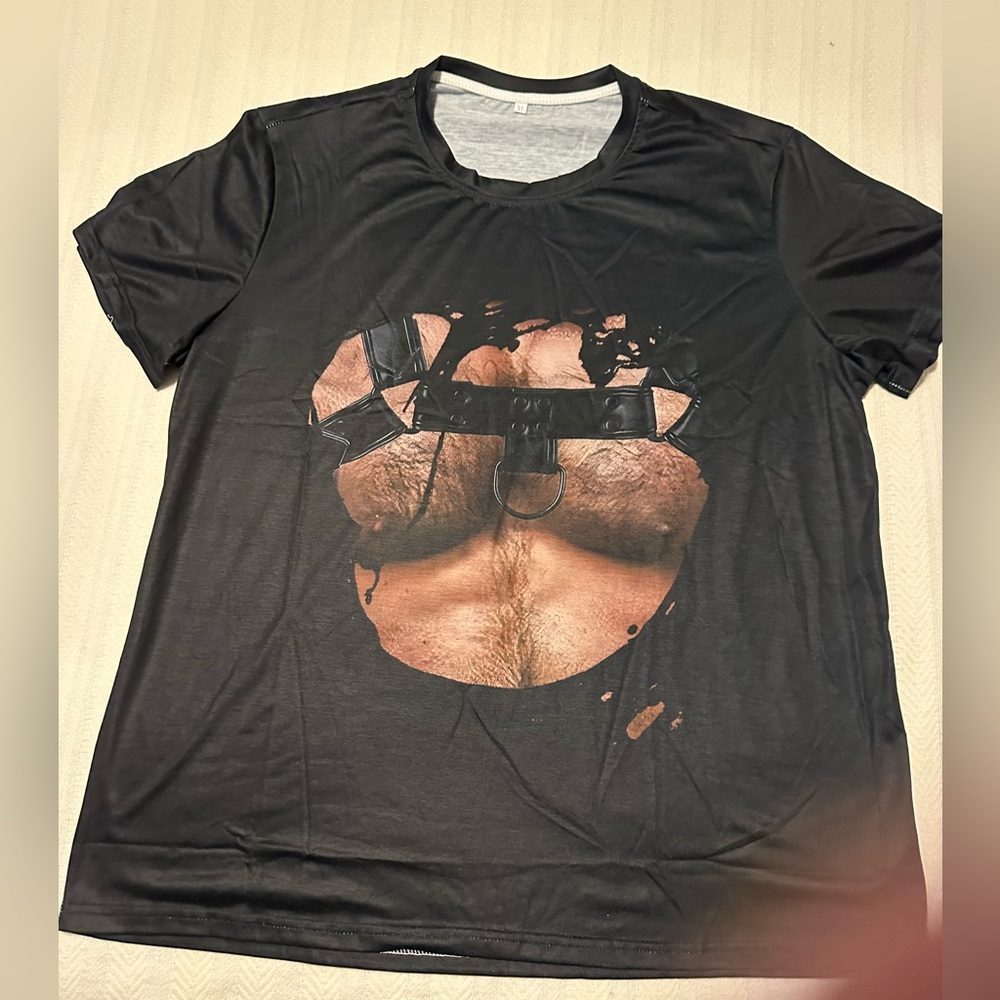 COPY - T-shirt showing a muscled hairy chest with harness. Be a tough manly-man!